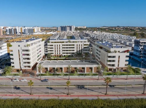 Render exterior de la promoción Insur Iris en Sevilla, destacando su arquitectura moderna de líneas limpias, fachada blanca y amplias terrazas. Se observa el entorno residencial ajardinado y la proximidad al Parque Dehesa Doña María.